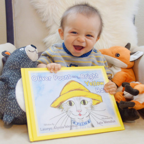 FEBURARYFOX112 Baby smiling with Oliver Poons and the Bright Yellow Hat